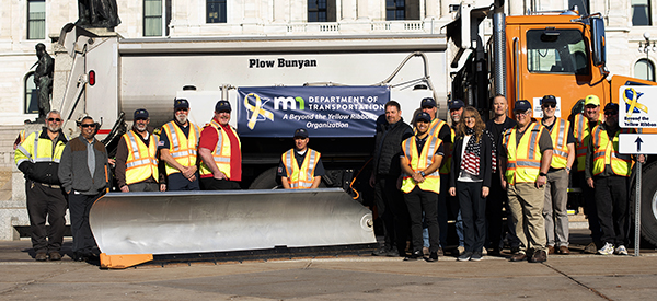 Photo: MnDOT Veterans in front of SnowPlow.
